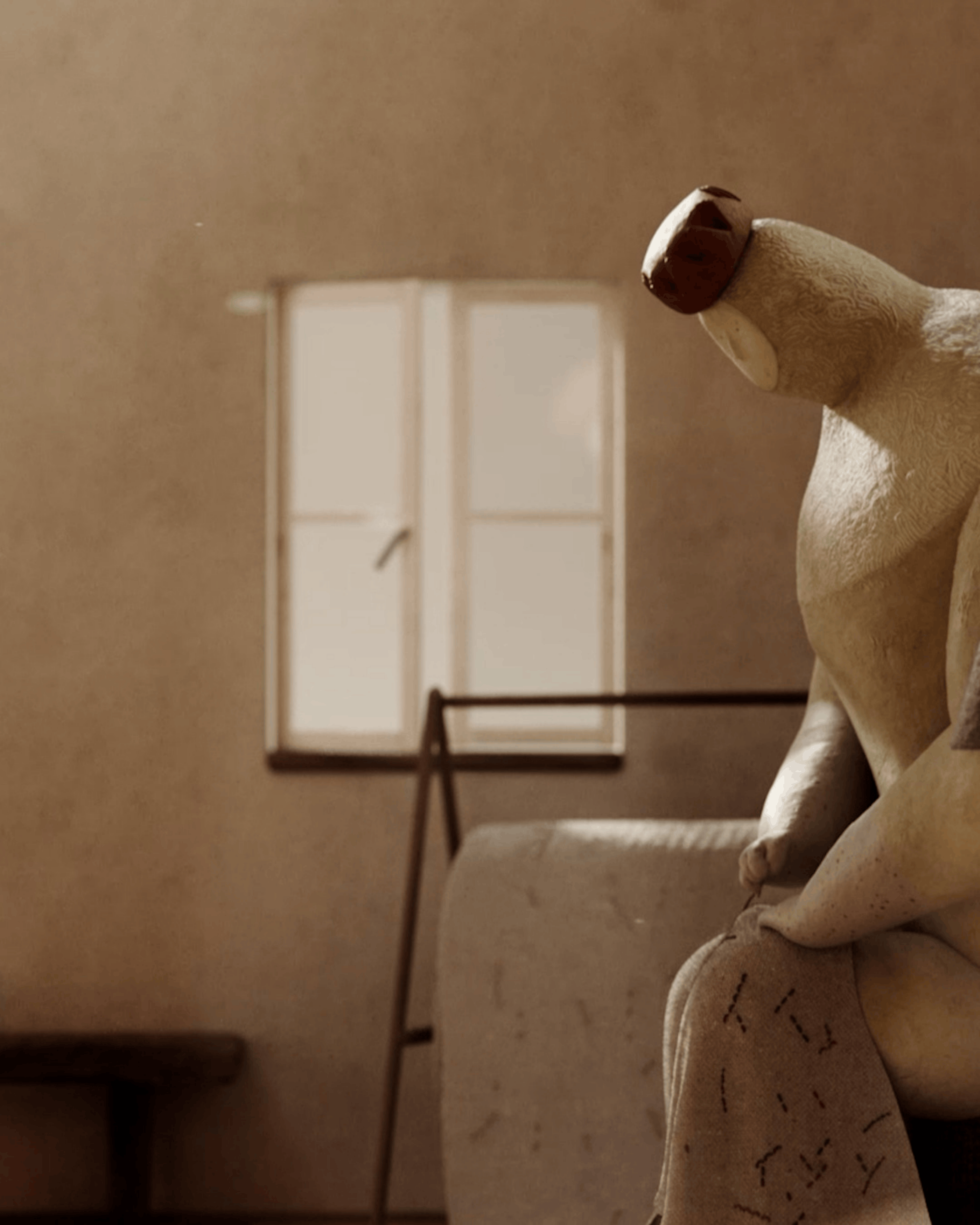 A character leaning near a sunlit window